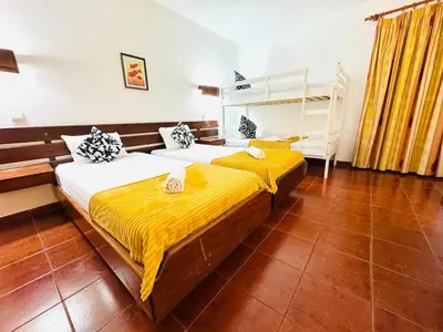 a bedroom with two beds and a bunk bed at Resort Albufeira Praia Oura in Albufeira