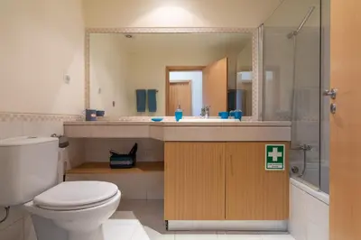 a bathroom with a toilet and a sink at Vista das ondas 205 by AS in Olhos de Água