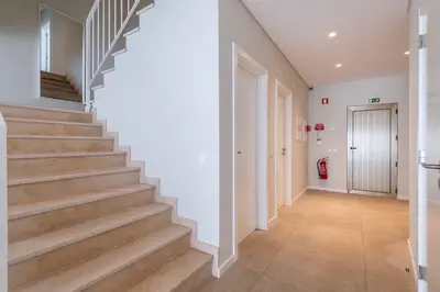 a hallway with stairs in a house at DK Stays Residences Albufeira in Albufeira
