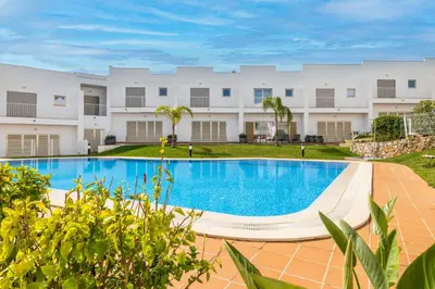 an image of a swimming pool in front of a building at DK Stays Residences Albufeira in Albufeira