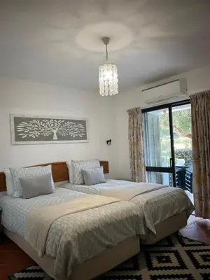 a bedroom with two beds and a window at Superior Apartment 361 Balaia Golf Village in Olhos de Água