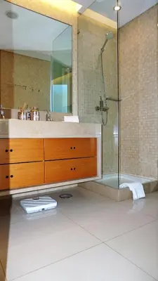 a bathroom with a sink and a shower at Luxury 3 Bedroom, 3 ensuits, Private pool, Vale do Lobo in Loulé