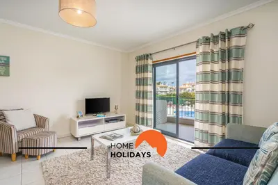 a living room with a couch and a tv at #284 Vista das Ondas by Home Holidays in Albufeira