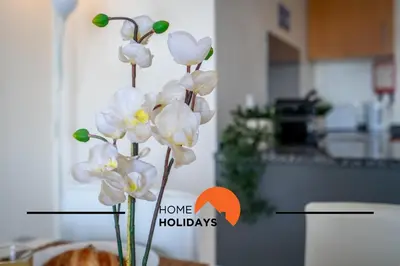 a bunch of white flowers in a vase in a kitchen at #284 Vista das Ondas by Home Holidays in Albufeira
