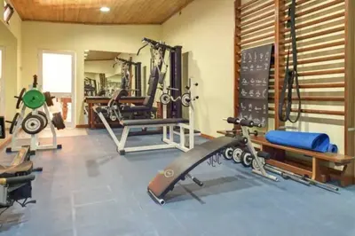 a gym with several treadmills and machines in it at Casablanca - Dream Lodging in Albufeira