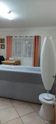 a large white bath tub in a living room at Oasis Apartment in Albufeira