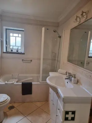 a bathroom with a tub and a sink and a toilet at Oasis Apartment in Albufeira
