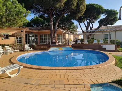 a swimming pool in front of a house at Mar à Vista Apartment in Albufeira