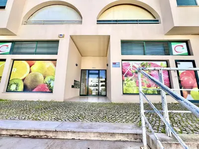 a building with paintings of fruit on the windows at Albufeira Salgados Beach 6 by Homing in Albufeira