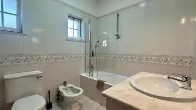 a bathroom with a toilet and a sink and a shower at Casa do Algarve by Check-in Portugal in Albufeira