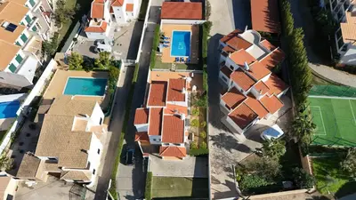 an overhead view of a group of houses with a pool at Casa do Algarve by Check-in Portugal in Albufeira