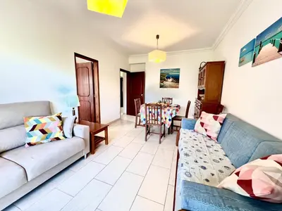 a living room with two couches and a table at Vilamoura Classic 2 with Pool by Homing in Quarteira