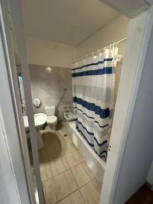 a bathroom with a sink and a toilet and a shower at Sweet Dreams in Albufeira