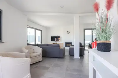 a living room with a couch and chairs and a table at Villa Soares - Centro Albufeira - For Families - BY BEDZY in Albufeira