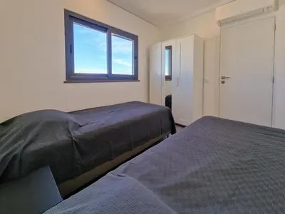 a bedroom with two beds and a window at Villa Soares - Centro Albufeira - For Families - BY BEDZY in Albufeira