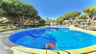 a room with a bed and a tv and a window at #272 T2 Bicos Flat J by Home Holidays in Albufeira