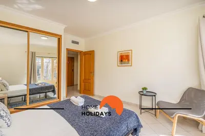 a living room with a bed and a couch at #273 T2 Bicos Flat M by Home Holidays in Albufeira