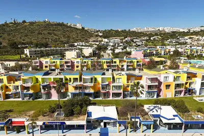 an aerial view of a city with colorful houses at Marina Orada Apartment with Pool - 900m from the Beach in Albufeira