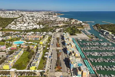 an aerial view of a harbor with boats at Marina Orada Apartment with Pool - 900m from the Beach in Albufeira