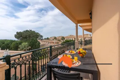 a balcony with a table with food on it at #274 T3 Bicos T by Home Holidays in Albufeira