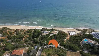 an aerial view of a beach with an orange arrow at #274 T3 Bicos T by Home Holidays in Albufeira