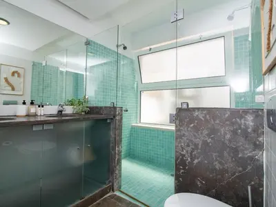 a bathroom with a glass shower and a toilet at Serenity 09 House by Stay ici Algarve Holiday Rental in Albufeira