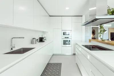 a laundry room with a washer and dryer at Penthouse Isabela VistaMar - Rooftop & Jacuzzi in Albufeira