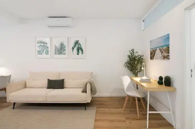 a living room with a couch and a table at Downtown Lux Apartment in Faro