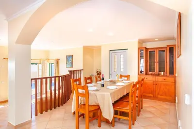 a dining room with a table and chairs at Villa Saona by Algarve Vacation in Albufeira