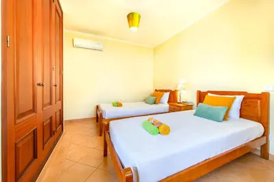 two beds in a room with two beds sidx sidx sidx sidx at Villa Saona by Algarve Vacation in Albufeira