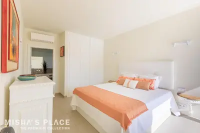 a bathroom with a sink and a mirror at Villa Alba - Albufeira Premium by Misha's Place in Albufeira