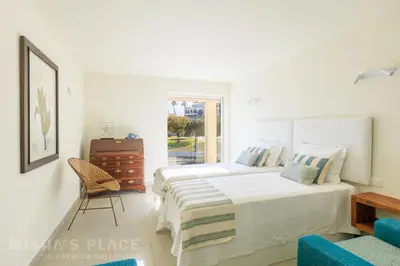 a living room with a couch and a table at Villa Alba - Albufeira Premium by Misha's Place in Albufeira