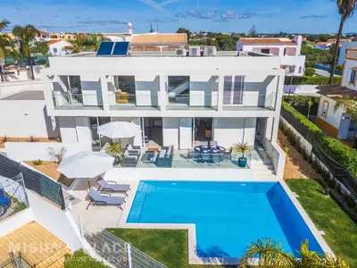 a room with a white wall at Villa Alba - Albufeira Premium by Misha's Place in Albufeira