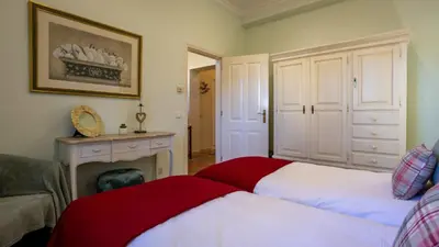 a bedroom with two beds and a fire place at 3Br Apt-Quinta do Lago-Private Terrace in Quinta do Lago