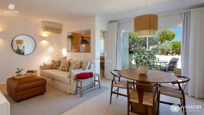 a living room with a couch and a table at Apartment Lamine in Loulé