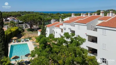 an aerial view of a villa with a swimming pool at Apartment Lamine in Loulé