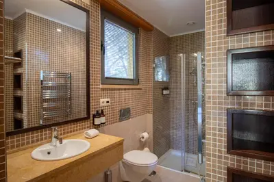 a bathroom with a toilet and a sink and a shower at Apartamento Vitoria in Vilamoura