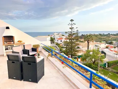 an aerial view of a white apartment building at Stunning Sunrise & Sunset Rooftop Condo by BeCherish in Albufeira