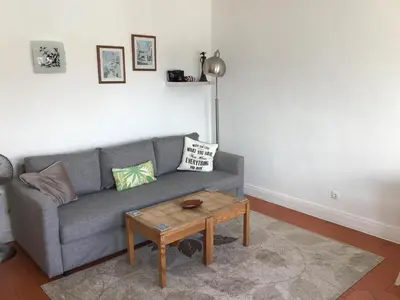a living room with a couch and a coffee table at Old Town, Bay View Apartment in Albufeira