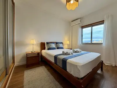 a room with two beds with towels on them at Albufeira Modern 6 With Pool by Homing in Albufeira