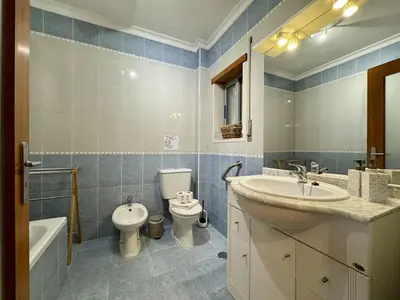 a bathroom with a sink and a bath tub at Albufeira Modern 6 With Pool by Homing in Albufeira