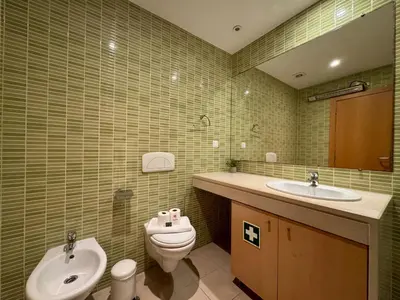 a bathroom with a sink and a toilet at Albufeira Modern 7 With Pool by Homing in Albufeira