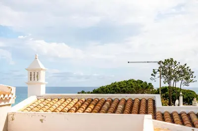 a view of the ocean from the roof of a building at Casa Bella in Loulé