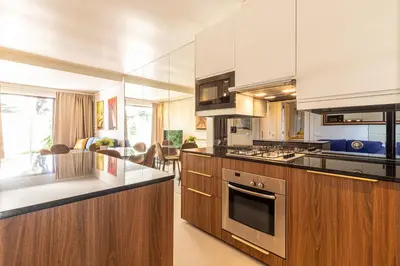 a hotel room with two beds and a window at BmyGuest - Vilamoura Golf Villa in Vilamoura