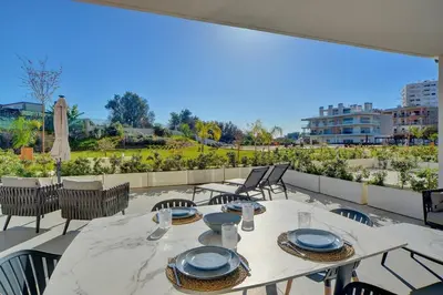 a table and chairs on a balcony with a view at Sofisticado Apartamento 3 quartos, terraço privado in Albufeira