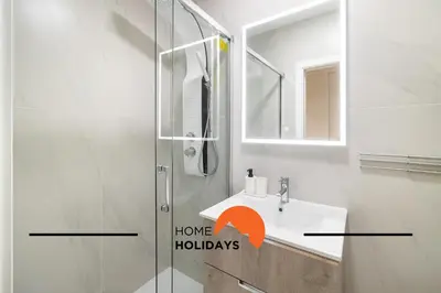 a bathroom with a shower and a sink with the words have holidays at #304 - Albufeira Beach House by Home Holidays in Albufeira