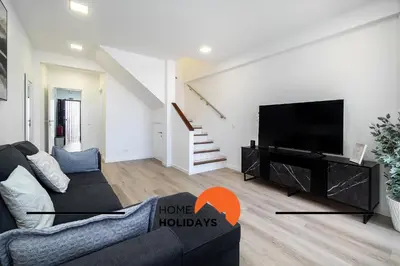 a living room with a couch and a flat screen tv at #305 Albufeira Sea House by Home Holidays in Albufeira
