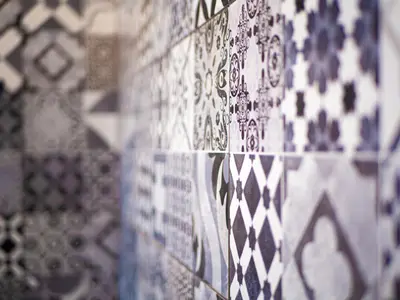 a close up of a wall with patterns on it at Boho house, Albufeira in Albufeira