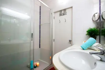 a bathroom with a sink and a glass shower at Apartment Milos by Algarve Vacation in Albufeira