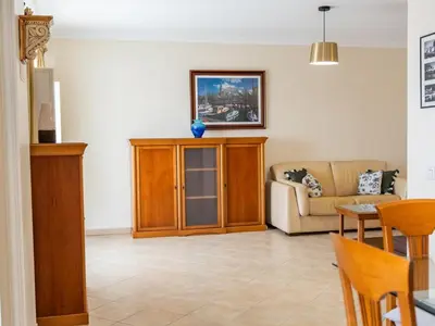 a living room with a couch and a table at Oura Sunrise 3B Apartment by Stay ici Algarve Holiday Rental in Albufeira